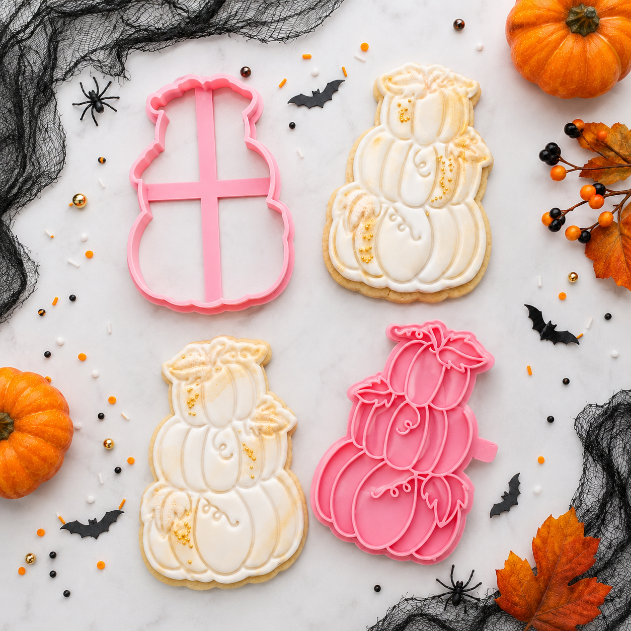 Decorative cookies shaped like pumpkins and a snowman with cookie cutters on a Halloween-themed background.