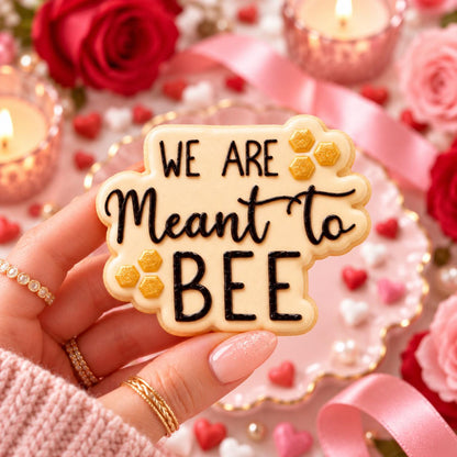 We Are Meant To Bee Valentine's Cookie Cutter and Embosser - decorated cookie held in hand