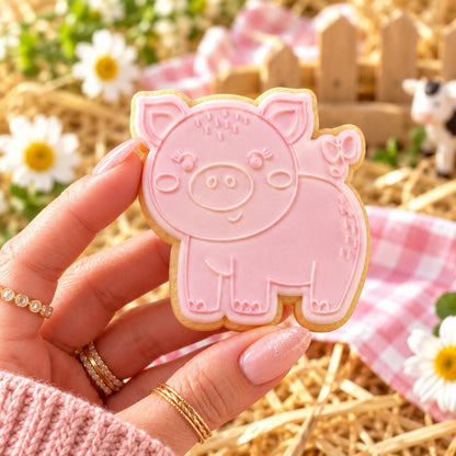 Pig Farm Yard Cookie Cutter and Embosser - decorated cookie held in hand