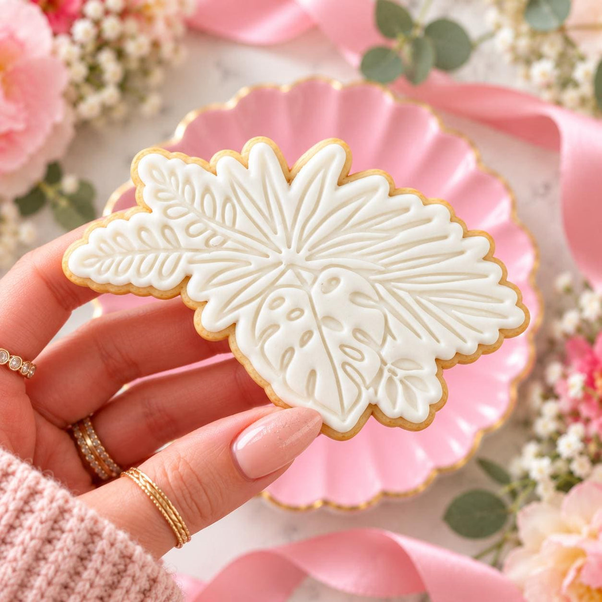 Tropical Flowers Cookie Cutter and Stamp - decorated cookie held in hand