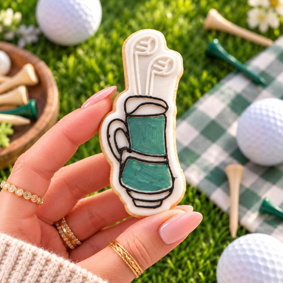 Mini Golf Bag Cookie Cutter and Embosser - decorated cookie held in hand