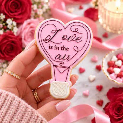 Love Is In The Air Valentine's Cookie Cutter and Embosser - decorated cookie held in hand