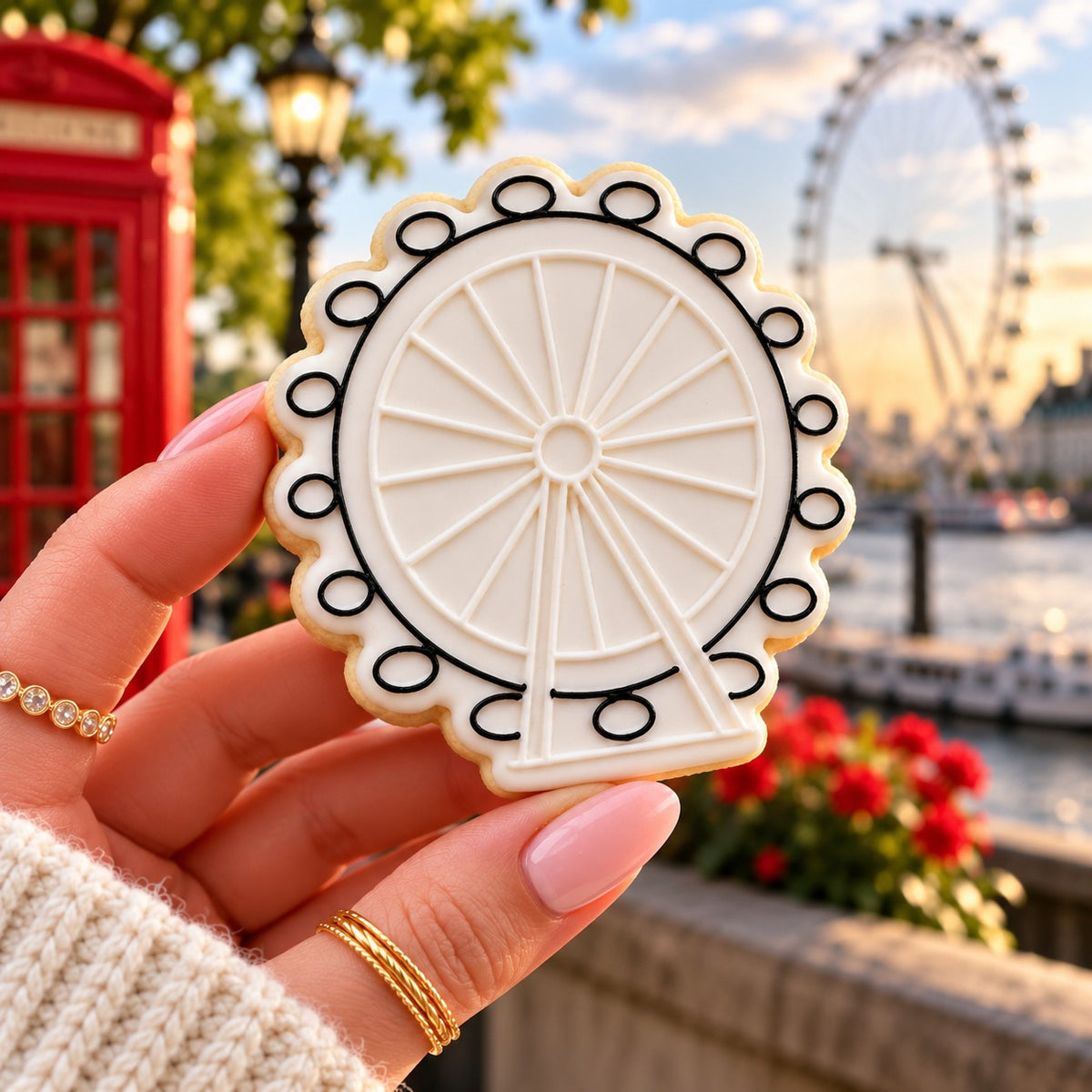 London Eye Cookie Cutter and Embosser - decorated cookie held in hand