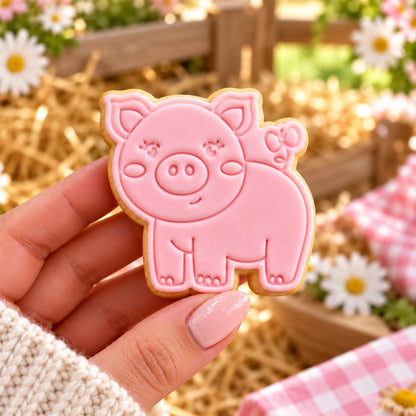 Pig Farm Yard Cookie Cutter and Stamp - decorated cookie held in hand