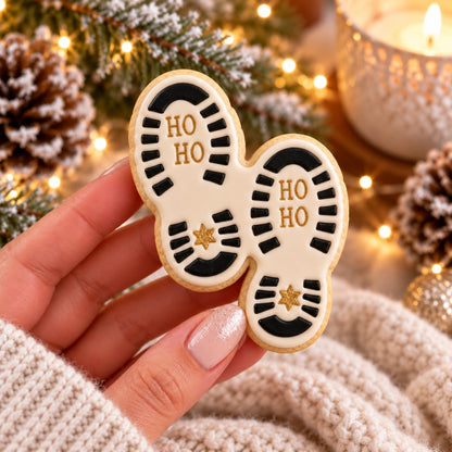 Santa's Footprint Christmas Cookie Cutter and Stamp - decorated cookie held in hand
