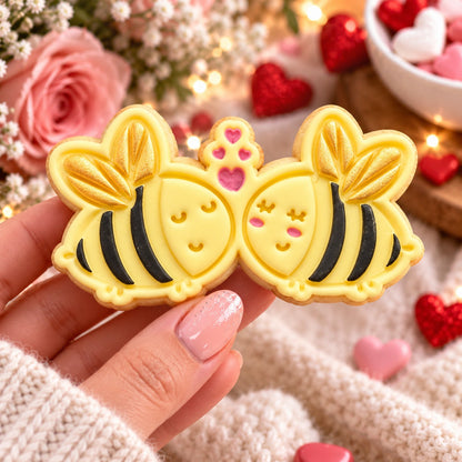 Two Bees In Love Valentine's Cookie Cutter and Stamp - decorated cookie held in hand